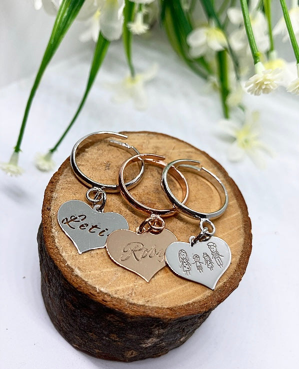 Anello cuore pendente